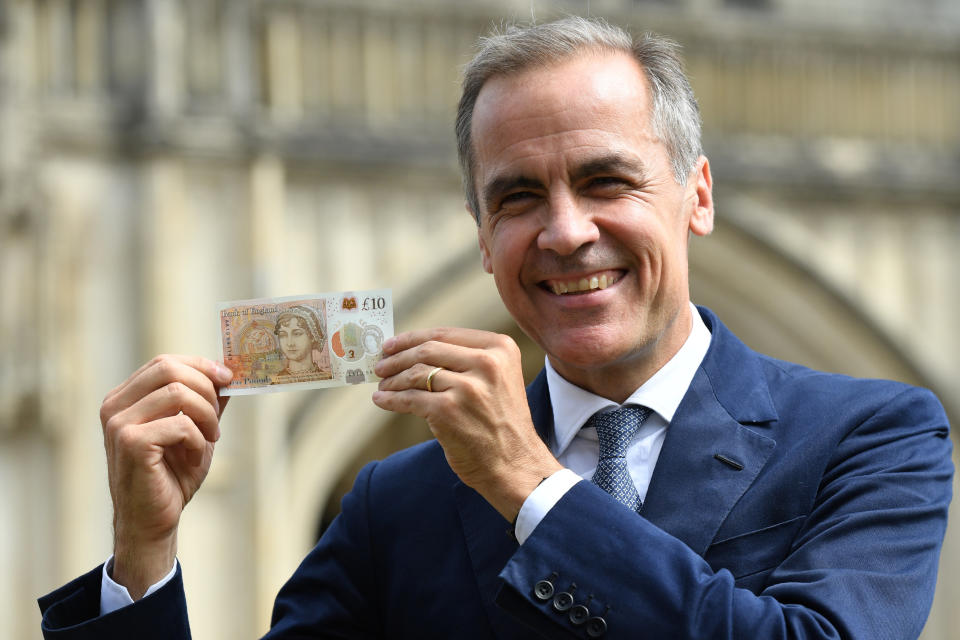 Bank of England Governor, Mark Carney, holds the new £10 note featuring Jane Austen, at Winchester Cathedral. (REUTERS/Chris J Ratcliffe/Pool)