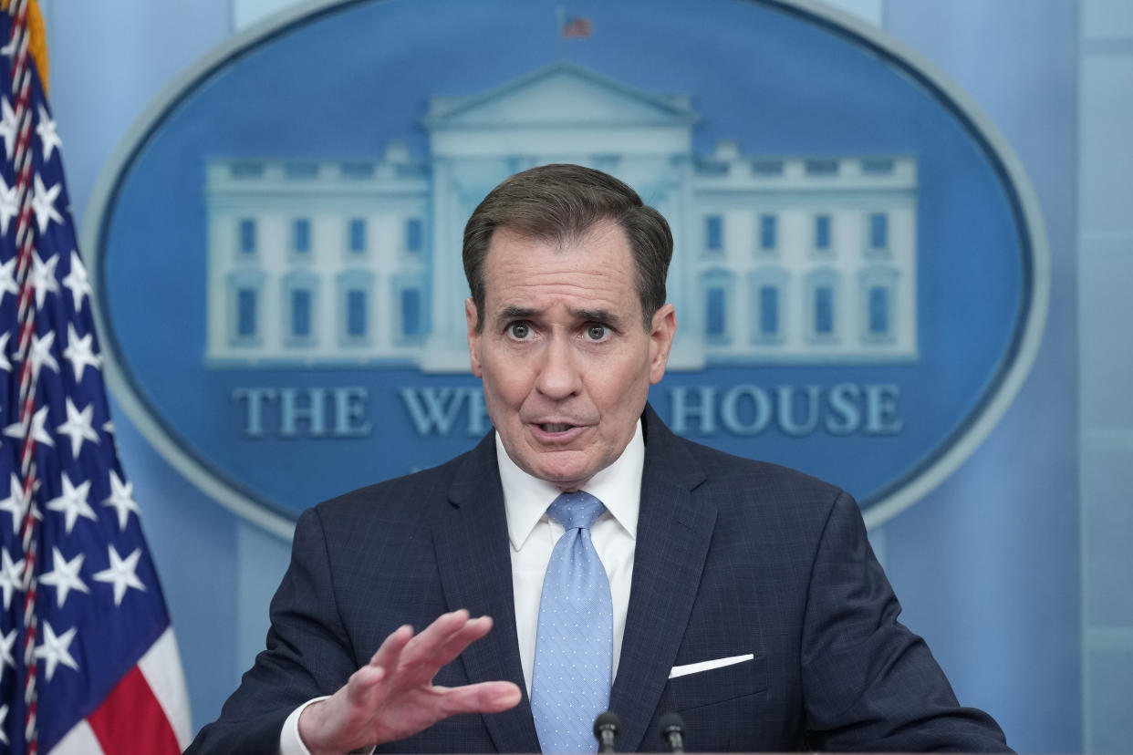 Adm. John Kirby at the microphone, with the White House seal behind him.