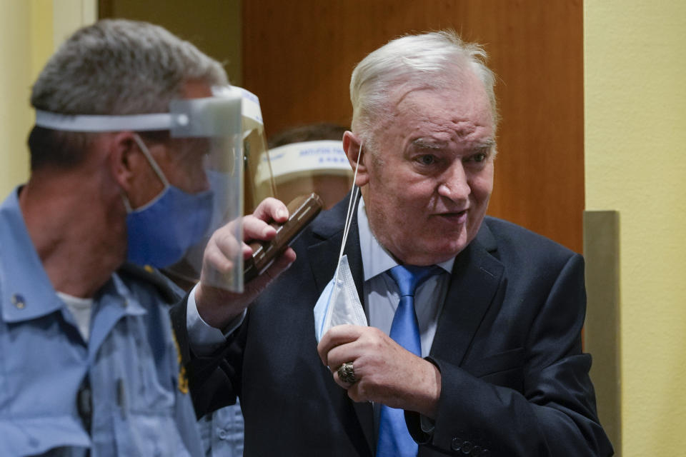Former Bosnian Serb military chief Ratko Mladic enters the court room in The Hague, Netherlands, Tuesday, June 8, 2021, where the United Nations court delivers its verdict in the appeal of Mladic against his convictions for genocide and other crimes and his life sentence for masterminding atrocities throughout the Bosnian war. (AP Photo/Peter Dejong, Pool)