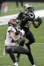 Tampa Bay Buccaneers wide receiver Scott Miller, left, catches a pass against New Orleans Saints cornerback Janoris Jenkins during the second half of an NFL divisional round playoff football game, Sunday, Jan. 17, 2021, in New Orleans. (AP Photo/Butch Dill)