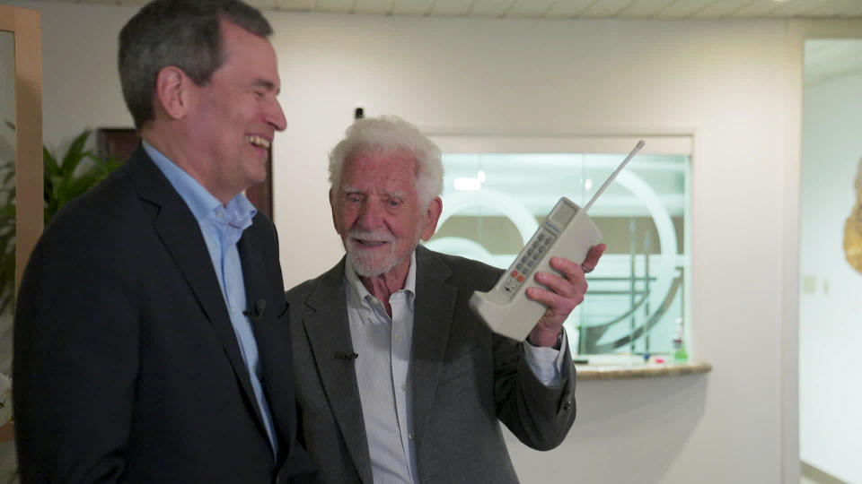 Correspondent David Pogue with Marty Cooper, inventor of the handheld cellular mobile phone.  / Credit: CBS News