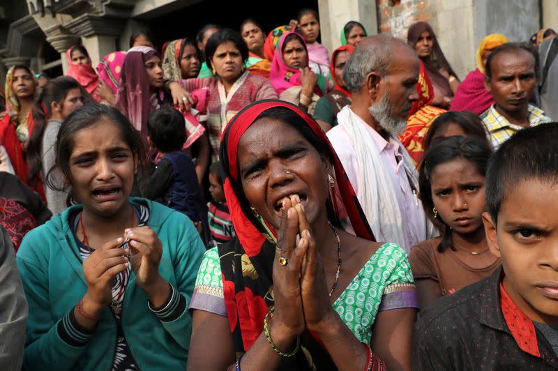 Relatives of the accused react as they demand a Central Bureau of Investigation probe into the rape of a 23-year-old victim, who died in a New Delhi hospital on Friday, after she was set on fire by a gang of men, which included her alleged rapists, i