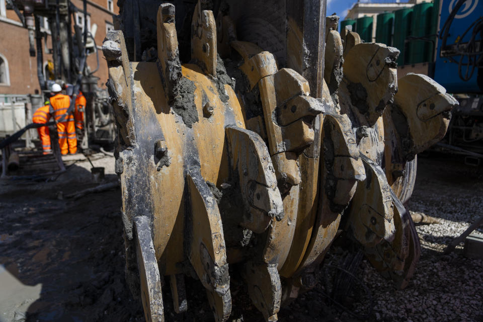 A giant hydro-milling machine rests inside the construction site of the new 25.5-kilometer Metro C subway main hub in Piazza Venezia in central Rome, Thursday, May 23, 2024. During a tour Thursday of the construction site at Piazza Venezia, chief engineer Andrea Sciotti said works on the nearly 3 billion euro project, considered one of the most complicated in the world, were running at pace to be completed by 2034. (AP Photo/Domenico Stinellis)