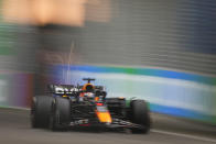 CORRECTS TO QUALIFYING SESSION - Red Bull driver Max Verstappen of the Netherlands steers his car during the qualifying session at the Singapore Formula One Grand Prix at the Marina Bay circuit, Singapore, Saturday, Sept. 16, 2023. (AP Photo/Vincent Thian)