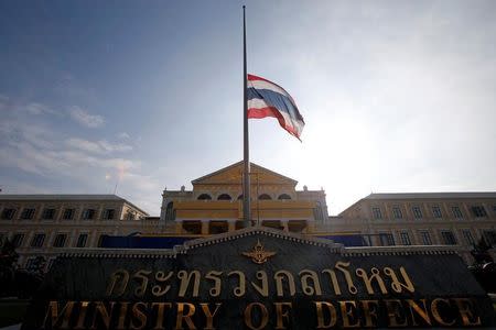 The Thai national flag flutters at half mast at the Ministry of Defence following the passing of King Bhumibol Adulyadej, in Bangkok, Thailand October 14, 2016. REUTERS/Edgar Su