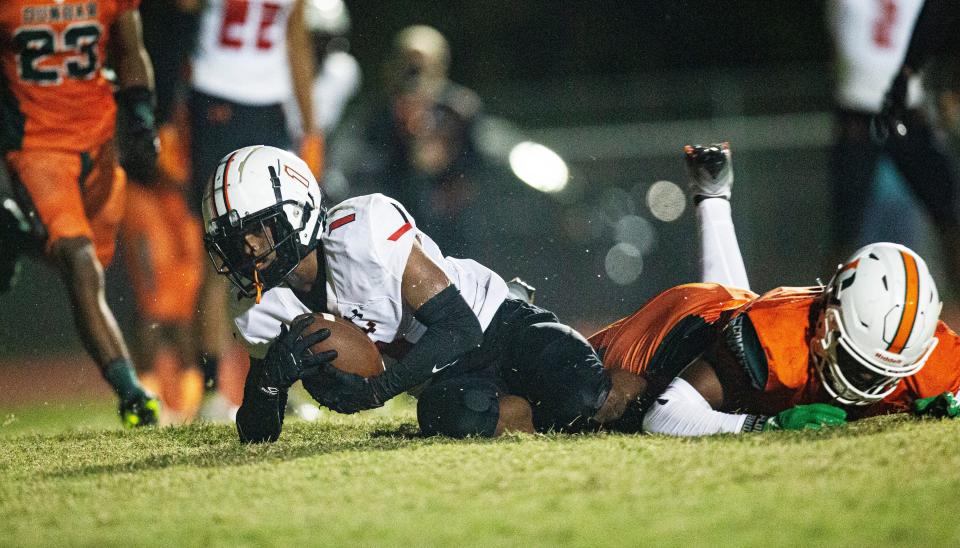 Lely's Ariel Pierre hauls in a touchdown pass against Dunbar on Friday Nov. 11, 2022