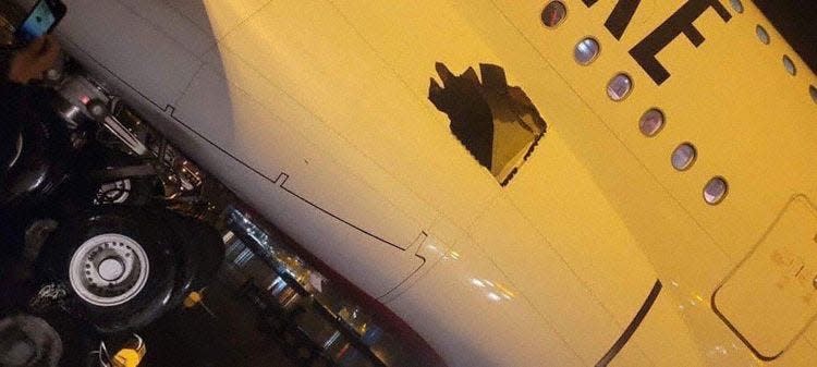 The hole on the Emirates Airbus A380 that departed from Dubai to Brisbane, Australia.