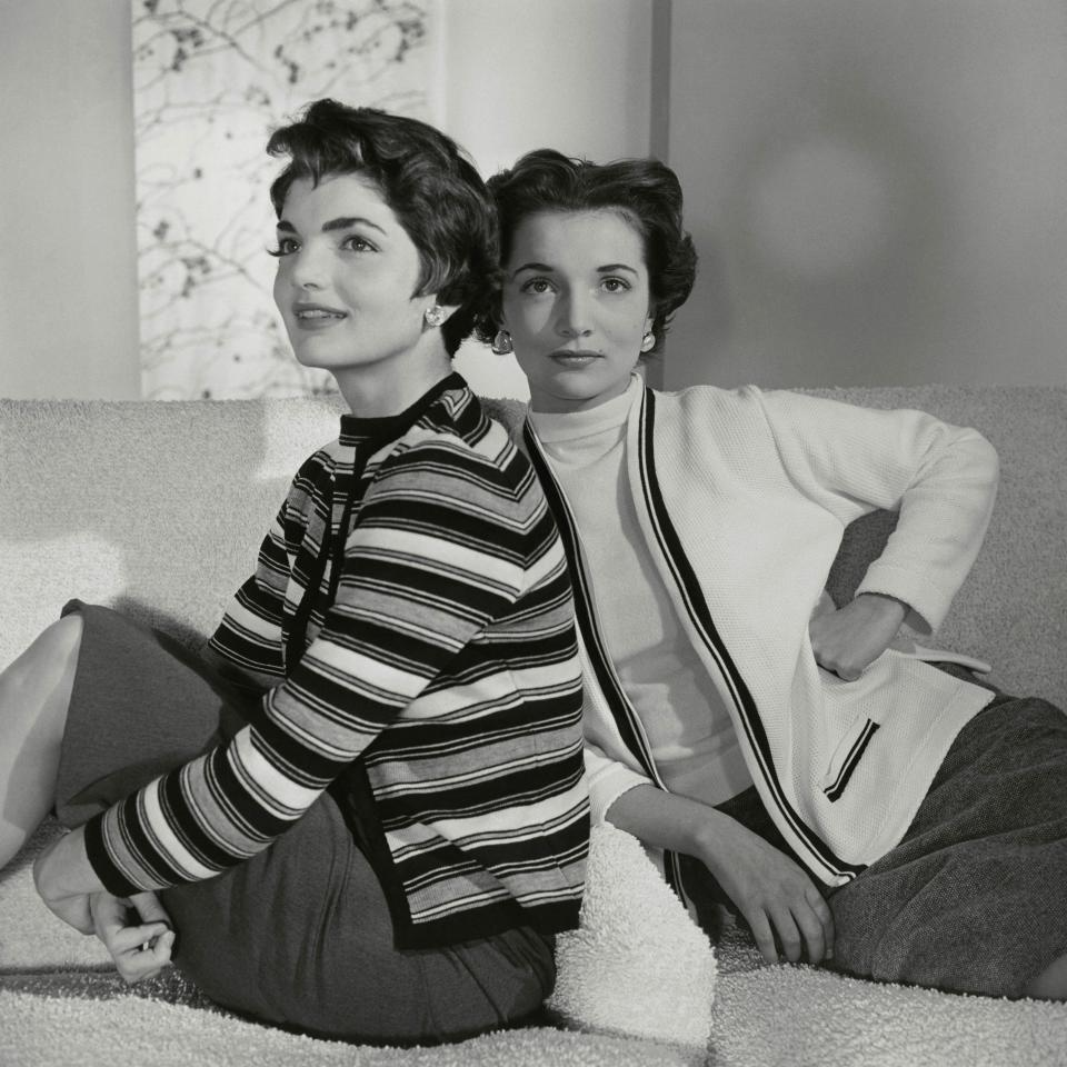 Kennedy wears a striped wool sweater alongside her sister.
