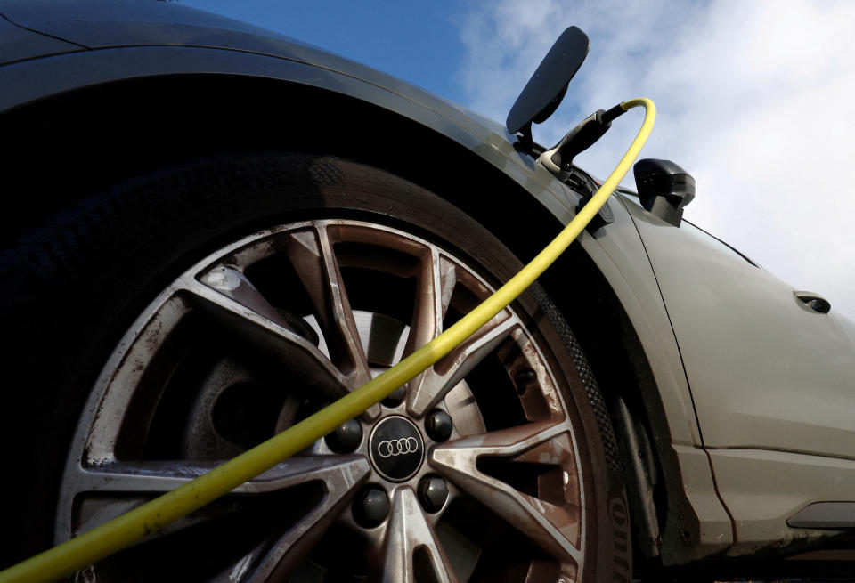 FILE PHOTO: An Audi electric vehicle is being charged in a charging station. November 25, 2023. REUTERS/Yves Herman/File Photo