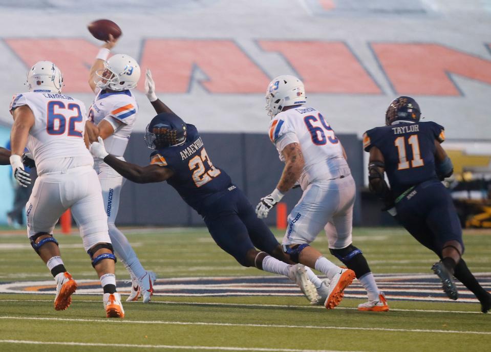 UTEP's Praise Amaewhule puts pressure on the Boise State quarterback in the first quarter of their game on Friday night in El Paso. UTEP won 27-10.