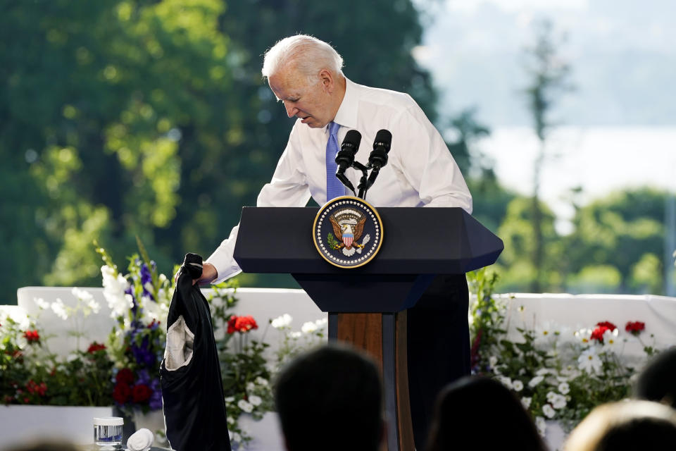 President Joe Biden takes off his jacket while speaking during a news conference after meeting with Russian President Vladimir Putin, Wednesday, June 16, 2021, in Geneva, Switzerland. (AP Photo/Patrick Semansky)