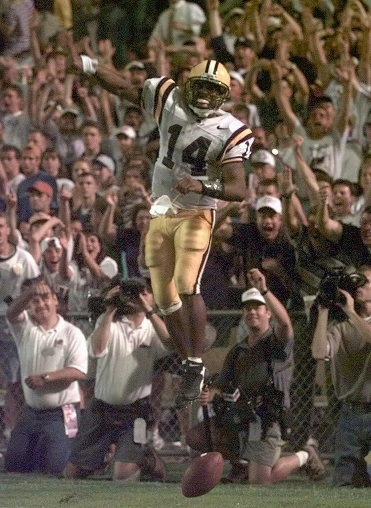 LSU quarterback Herb Tyler (14) celebrates after rushing for his second touchdown against Florida Saturday night Oct.11, 1997 in Baton Rogue, La. Tyler raced around the right end for a touchdown during fourth quarter action. (AP Photo/Bill Feig)