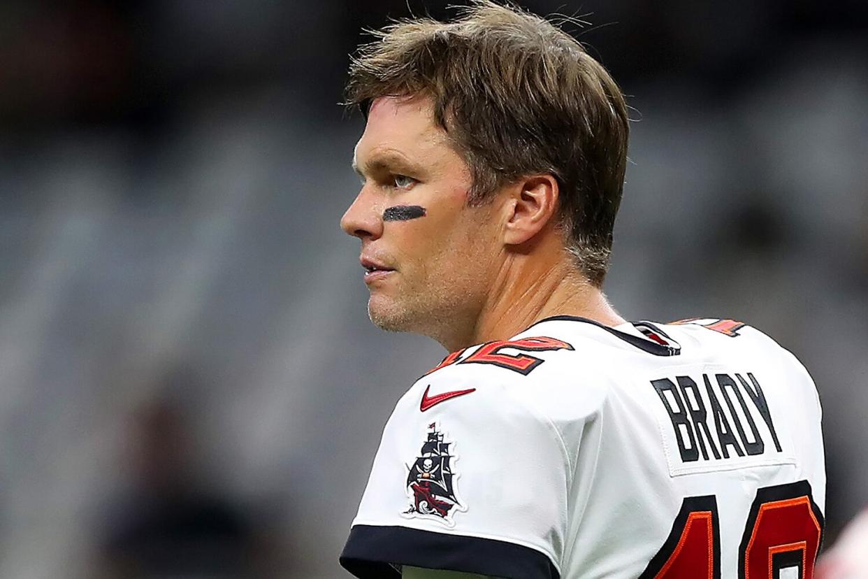 Tampa Bay Buccaneers quarterback Tom Brady (12) takes his helmet off and looks towards the sidelines during the Tampa Bay Buccaneers-New Orleans Saints regular season game on September 18, 2022 at Caesars Superdome in New Orleans, LA.