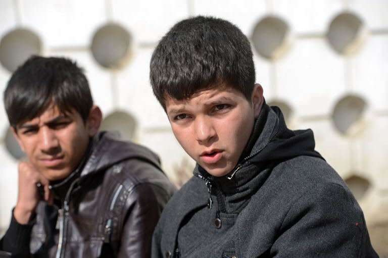 Afghan actors Jawanmard Paiz (R) and Fawad Mohammadi during an interview with AFP in Kabul on February 9, 2013. Both star in "Buzkashi Boys", a film about two youngsters growing up in Kabul who dream of becoming Buzkashi horseback riders in Afghanistan's national sport