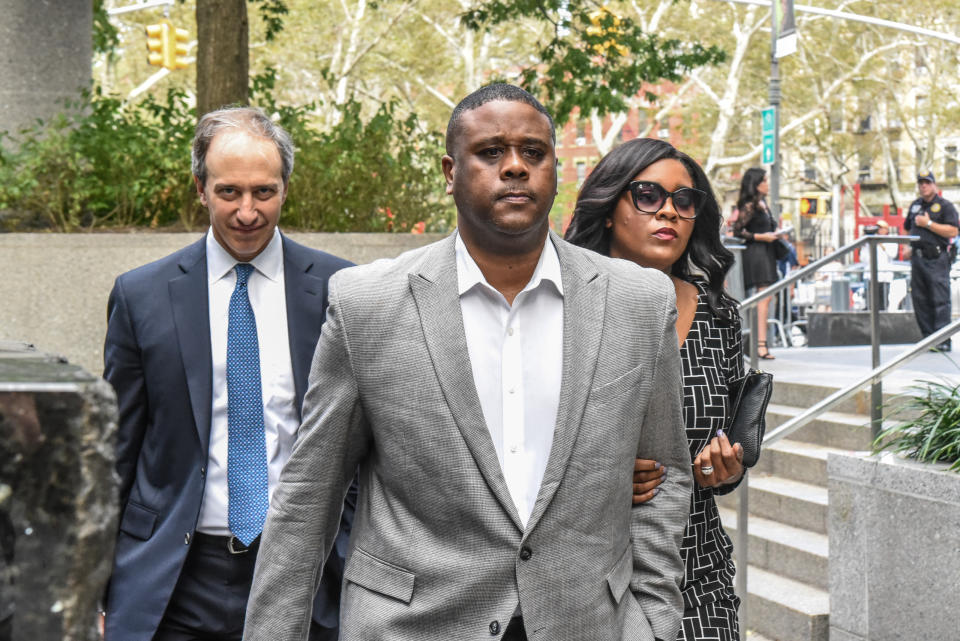 Former Adidas consultant Merl Code (center) is suing the shoe company after he served prison time for actions he claims he did on the company's request. (Photo by Stephanie Keith/Getty Images)
