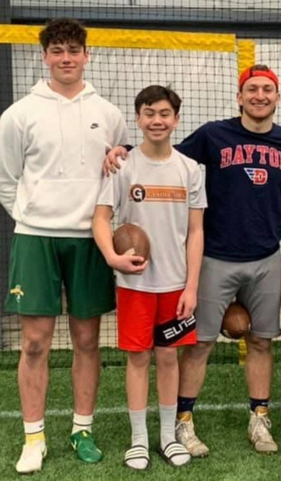 Walsh Jesuit incoming freshman David Ternosky, center,  stands with Mr. Football Drew Allar of Medina, left, and Hoban's Shane Hamm. Allar is slated to start for Penn State this season. Hamm is a quarterback at Kentucky.