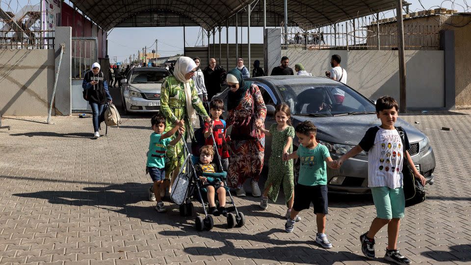 People enter the Rafah border crossing on Wednesday. - Mohammed Abed/AFP/Getty Images