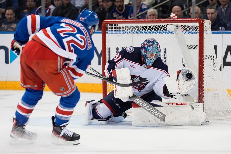 Columbus Blue Jackets goaltender Elvis Merzlikins (90) stops a shot by New York Rangers' Jonny Brodzinski (22) during the first period of an NHL hockey game Wednesday, Feb. 28, 2024, in New York. (AP Photo/Frank Franklin II)