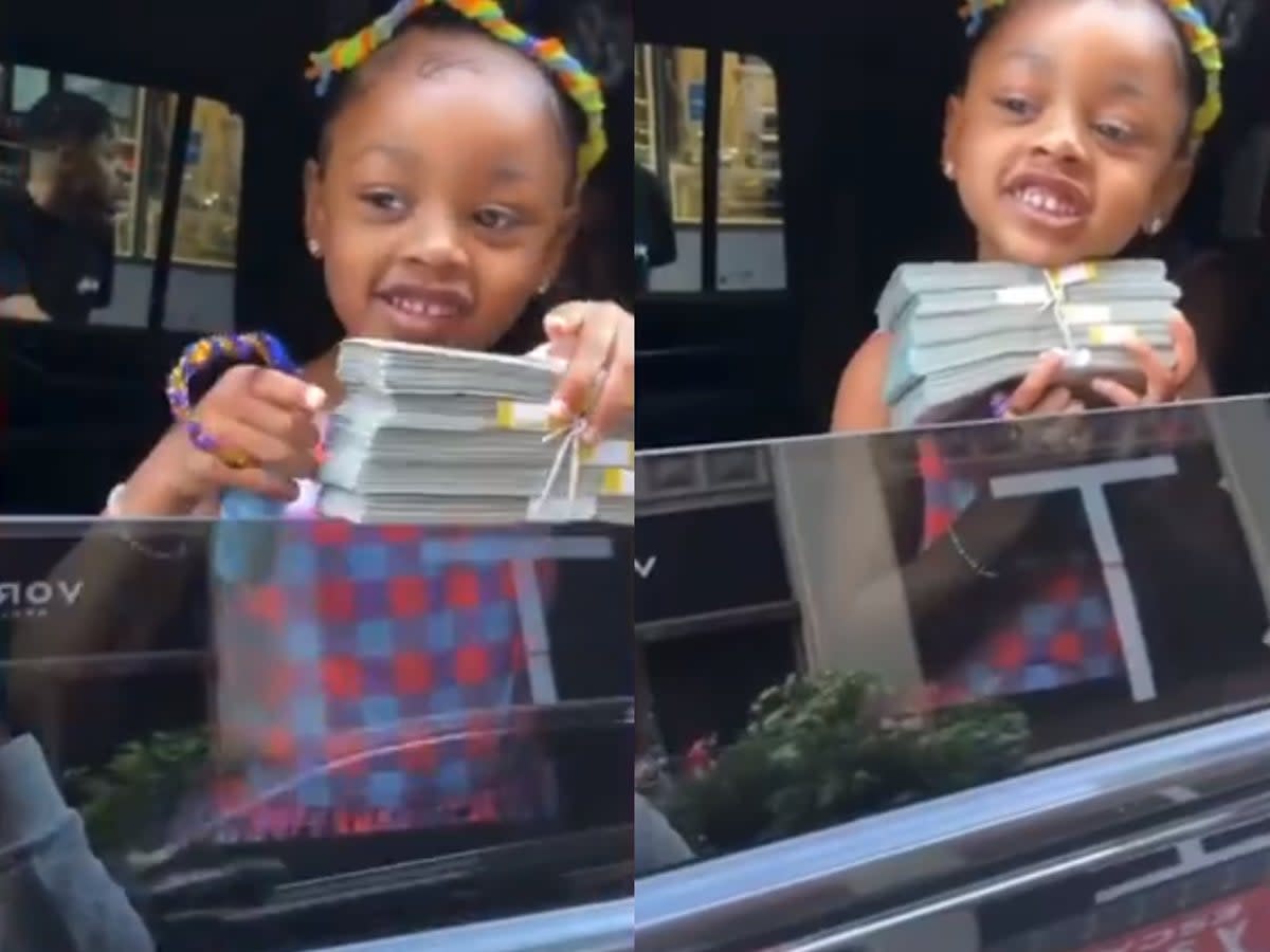 Kulture, the eldest daughter of Cardi B and Offset, holds a stack of cash given to her for her birthday (Offset/Instagram)