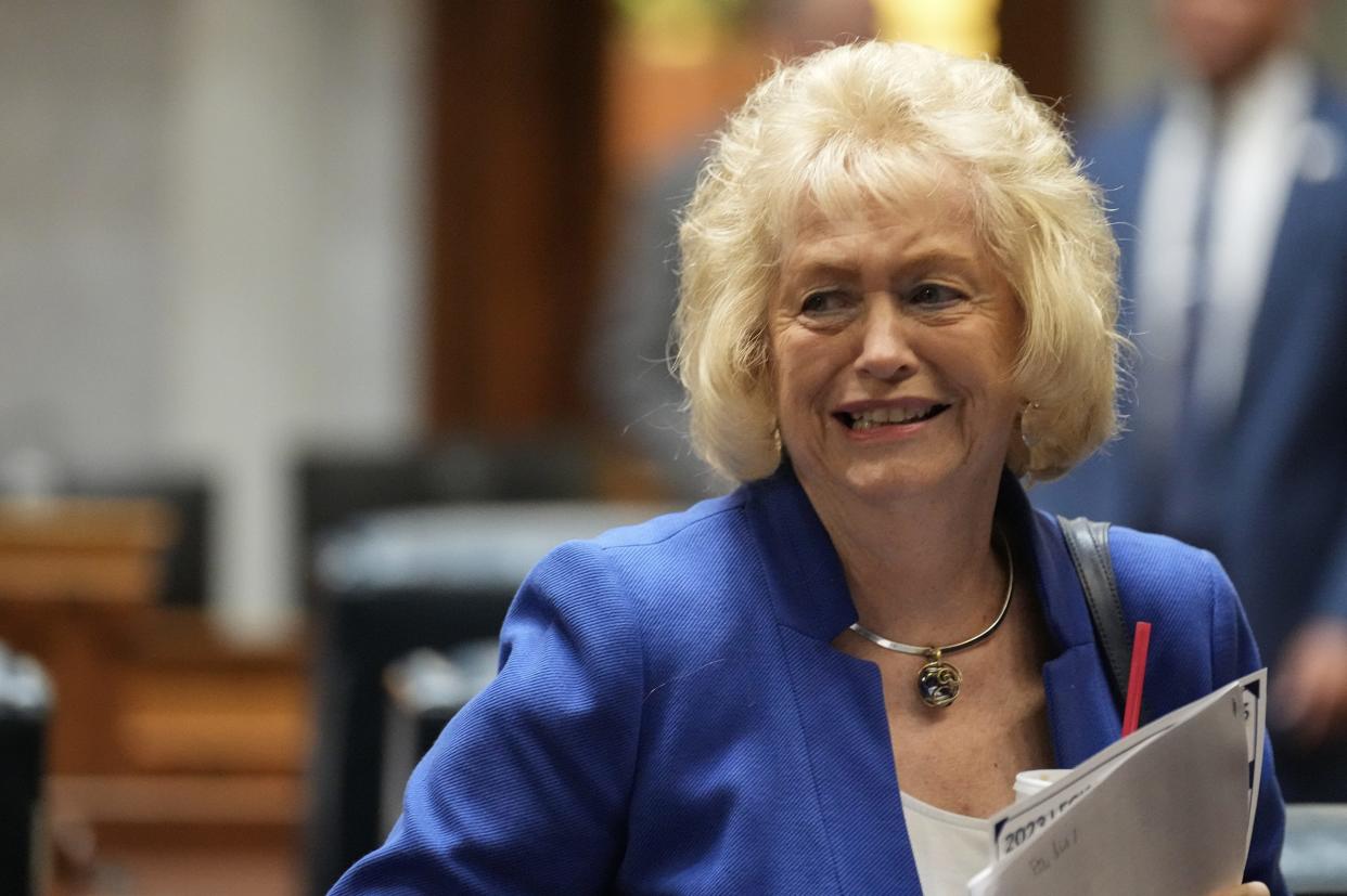 Indiana Sen. Vaneta Becker talks with fellow senators after closing out the first legislative session of the year Monday, Jan. 9, 2023, at the Indiana Statehouse in Indianapolis.