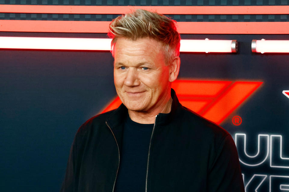Gordon Ramsay smiling in black outfit at event
