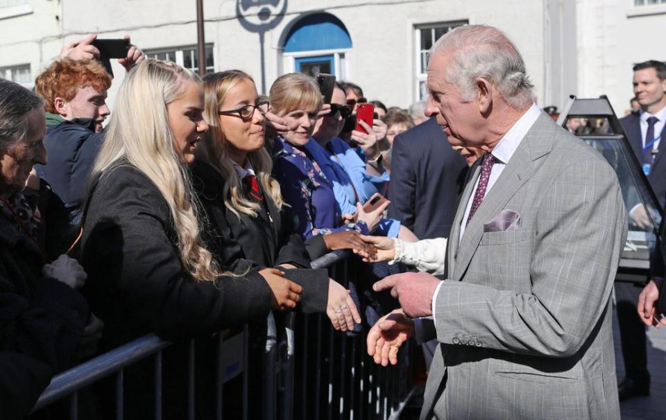 Charles chatted to members of the public who had lined the streets to greet the royal visitors (Julien Behal Photography/PA) (PA Media)