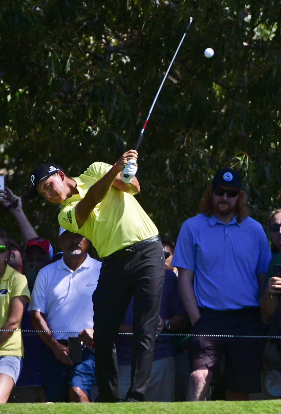 Rickie Fowler hits off the third tee during the second round of the Tour Championship golf tournament Friday, Sept. 21, 2018, in Atlanta. (AP Photo/John Amis)