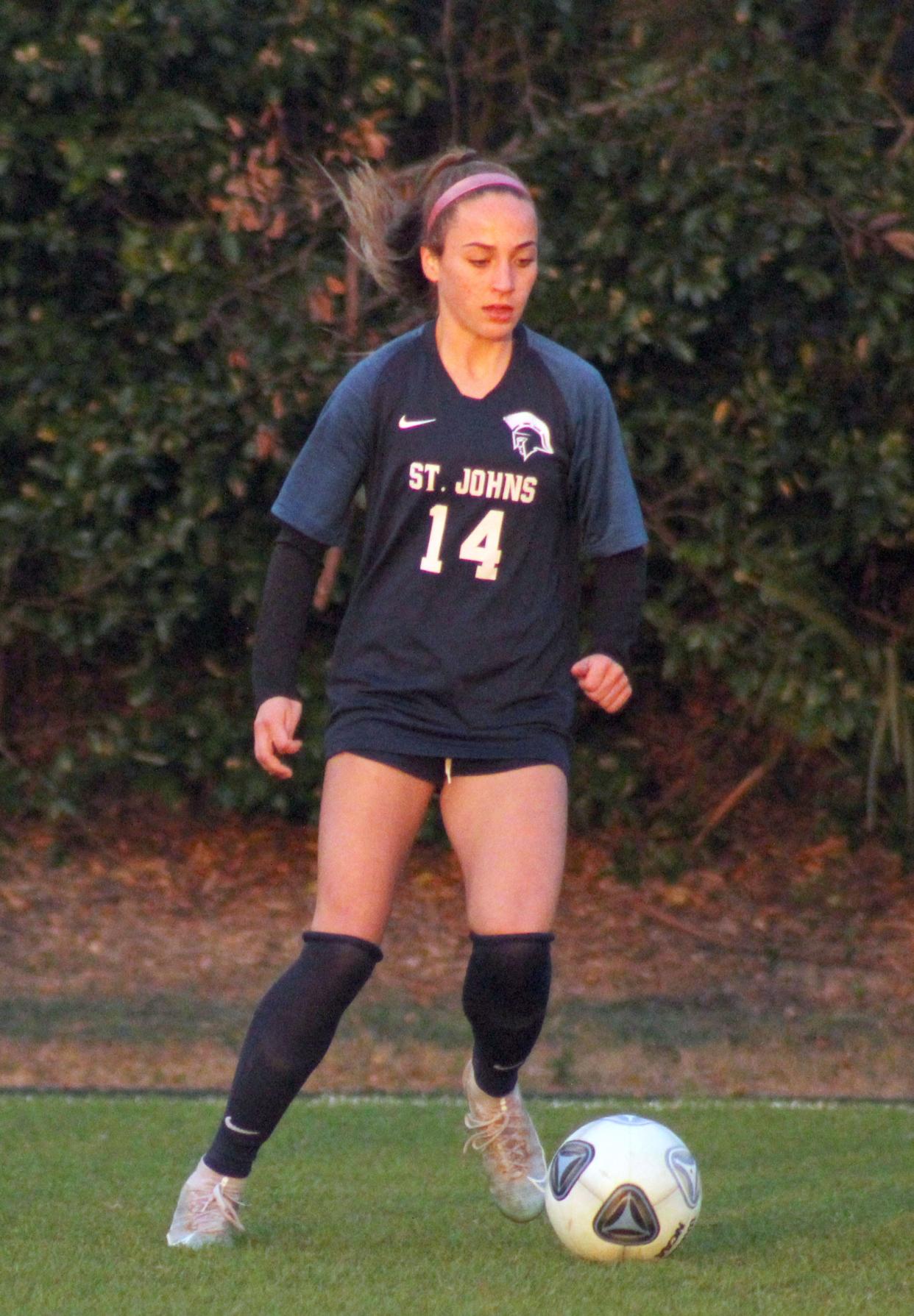 St. Johns Country Day midfielder Sydney Schmidt (14) dribbles during an FHSAA Class 2A girls soccer playoff against Christ's Church on February 15, 2022. [Clayton Freeman/Florida Times-Union]