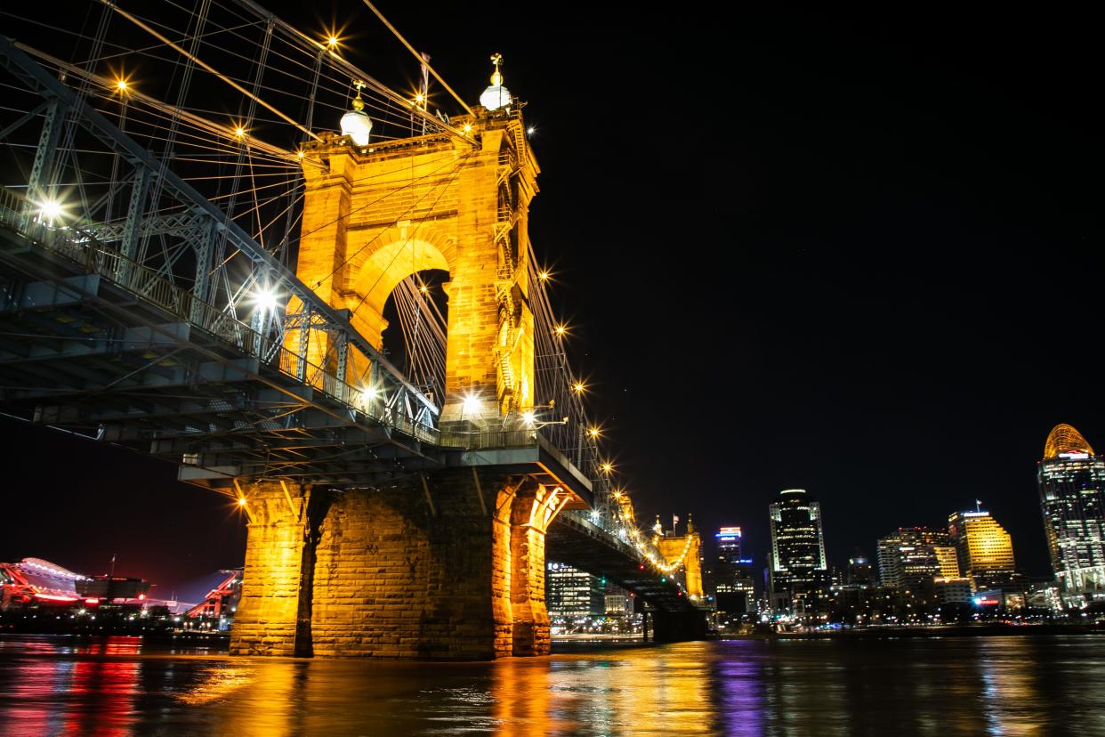 The Roebling Bridge and the Cincinnati Riverfront are lit up after the Bengals Super Bowl kickoff rally on Monday, February 7, 2022. 