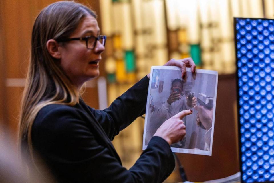 Miami-Dade Assistant State Attorney Sara Imm shows a picture of convicted killer George Walton holding a gun, as she addresses the jury during final arguments Wednesday, Feb. 21, 2024. Walton was convicted of first-degree murder in the 2020 shooting death of 18-year-old Andrea Camps-Lacayo, a Miami-Dade high school senior. Pedro Portal/pportal@miamiherald.com