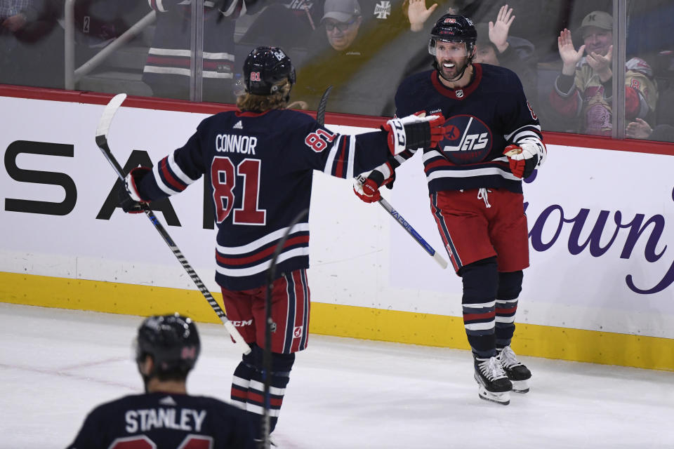 Winnipeg Jets' Sam Gagner (89) celebrates after his goal against the St. Louis Blues with teammate Kyle Connor during the third period of NHL hockey game action in Winnipeg, Manitoba, Monday, Oct. 24, 2022. (Fred Greenslade/The Canadian Press via AP)