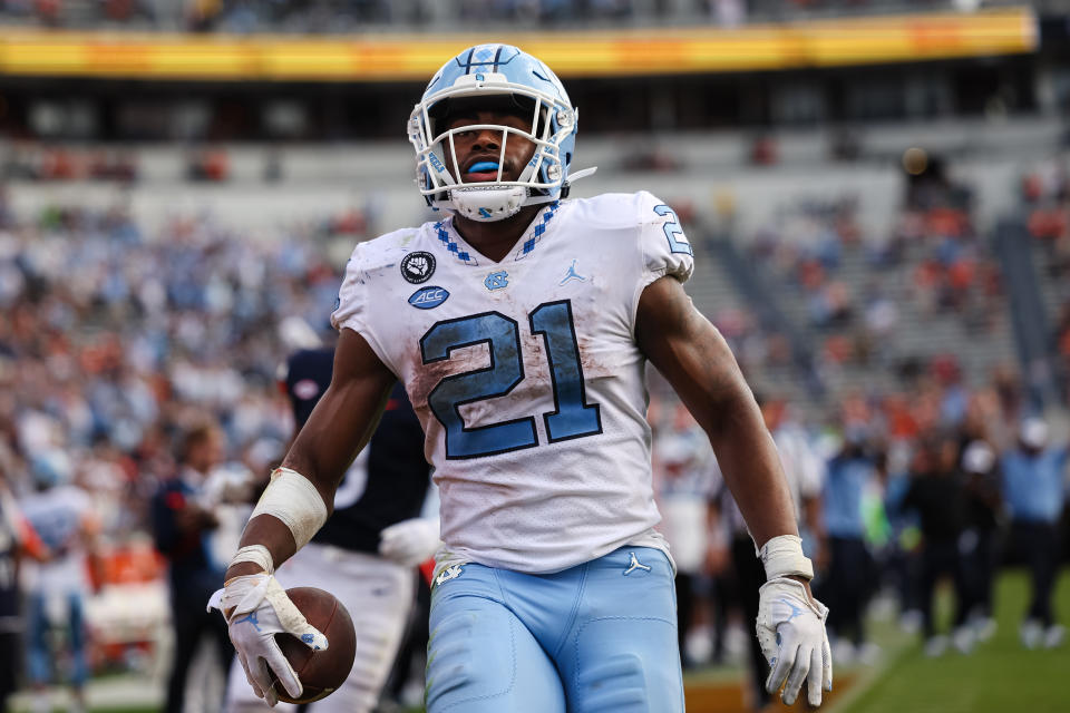 Nov 5, 2022; Charlottesville, Virginia, USA; North Carolina Tar Heels running back Elijah Green (21) runs for a touchdown against the Virginia Cavaliers during the second half at Scott Stadium. Mandatory Credit: Scott Taetsch-USA TODAY Sports