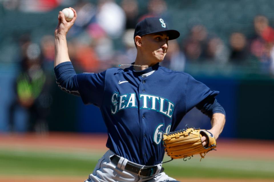 Seattle Mariners starting pitcher George Kirby delivers against the Cleveland Gardians during the first inning of a baseball game, Sunday, April 9, 2023, in Cleveland. (AP Photo/Ron Schwane)