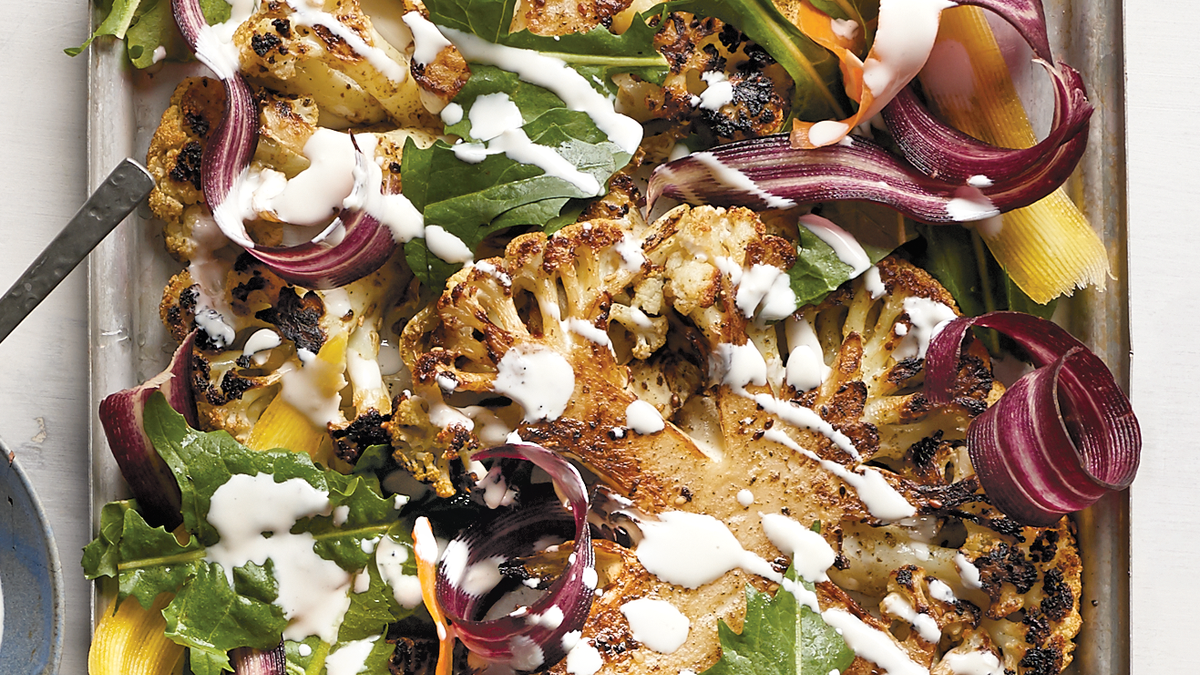 a plate of food cauliflower steak vegetarian