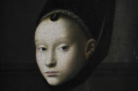 Detail of the painting by Petrus Christus titled Portrait of a Young Woman, around 1470, during a press preview of the Remember Me exhibit at the Rijksmuseum in Amsterdam, Netherlands, Tuesday, Sept. 28, 2021. As COVID-19 lockdowns ease and borders reopen, there is a gathering at Amsterdam's Rijksmuseum of people from around Europe, depicted in more than 100 Renaissance portraits. The Dutch national museum's new exhibition “Remember Me,” covers the century 1470-1570. (AP Photo/Peter Dejong)