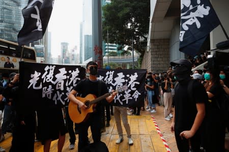 Supporters of jailed activist Edward Leung, gather outside the High Court as Leung appeals against his conviction and sentence, in Hong Kong, China