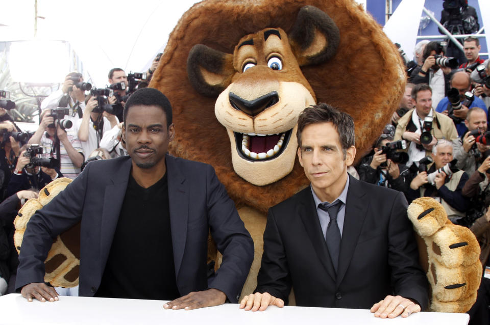 Actors Chris Rock, left, Ben Stiller, right and an actor dressed as a cartoon character, pose during a photo call for Madagascar 3: Europe's Most Wanted at the 65th international film festival, in Cannes, southern France, Friday, May 18, 2012. (AP Photo/Joel Ryan)