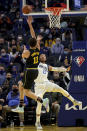 Golden State Warriors guard Klay Thompson (11) shoots against Dallas Mavericks guard Jalen Brunson (13) during the first half of an NBA basketball game in San Francisco, Tuesday, Jan. 25, 2022. (AP Photo/Jed Jacobsohn)