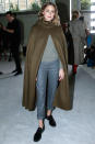<p><strong>2 October</strong> Olivia Palermo opted for a khaki cape over her relaxed jumper and chino outfit. </p>
