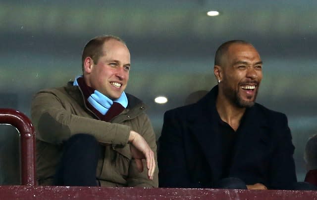 William watching Aston Villa with one of the club's former players John Carew. Paul Harding/PA Wire