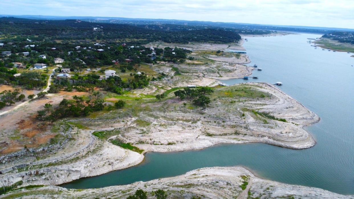 A photo from high above Lake Travis shows the land that will become the signature fifth hole at the Travis Club golf course. Groundbreaking for the course was this week.