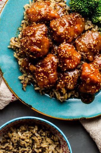 <p>Crispy chicken underneath a sticky and sweet honey sauce? Served with rice, you'll never need takeout again!</p><p>Get the <a href="https://www.delish.com/uk/cooking/recipes/a29559363/crispy-honey-sesame-chicken-recipe/" rel="nofollow noopener" target="_blank" data-ylk="slk:Crispy Honey Sesame Chicken;elm:context_link;itc:0;sec:content-canvas" class="link ">Crispy Honey Sesame Chicken</a> recipe.</p>