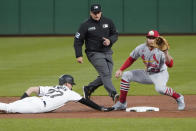 St. Louis Cardinals second baseman Brendan Donovan, right, awaits the pickoff attempt from starting pitcher Jose Quintana as Pittsburgh Pirates' Kevin Newman (27) dives back to second during the first inning of a baseball game, Monday, Oct. 3, 2022, in Pittsburgh. Newman was safe. (AP Photo/Keith Srakocic)