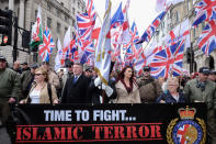 Protesters hold placards and British Union Jack flags during a protest titled 'London march against terrorism' in response to the March 22 Westminster terror attack on April 1, 2017 in London, England. The march has been organised by far-right groups English Defence League and Britain First, which also sees a counter-protest held by group 'Unite Against Fascism'. During the terror attack in Westminster, Khalid Masood killed 4 people as he drove a car into pedestrians over Westminster Bridge and stabbed PC Keith Palmer to death before being shot dead himself. (Photo by Jay Shaw Baker/NurPhoto via Getty Images)