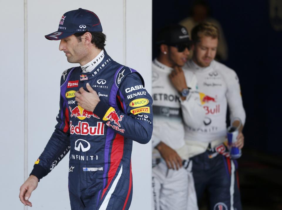 Red Bull Formula One driver Mark Webber of Australia walks after taking pole position after the qualifying session of the Japanese F1 Grand Prix at the Suzuka circuit October 12, 2013. REUTERS/Issei Kato (JAPAN - Tags: SPORT MOTORSPORT F1)