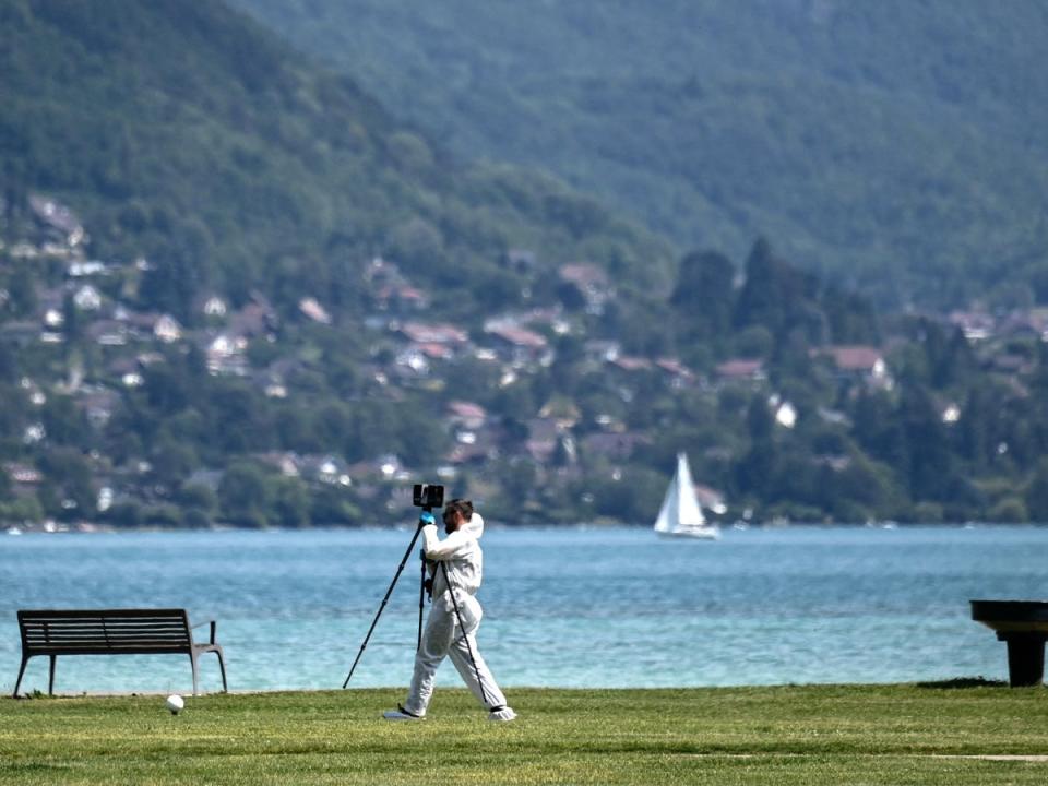 A French forensic police officer during the investigation around the lake in  Annecy (Olivier Chassignole/AFP via Getty Images)