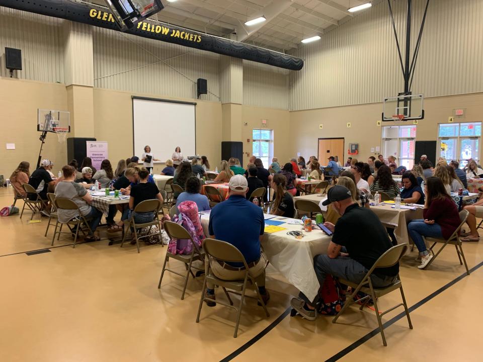 Parents of kindergarteners at Glencoe Elementary School learn about school procedures.