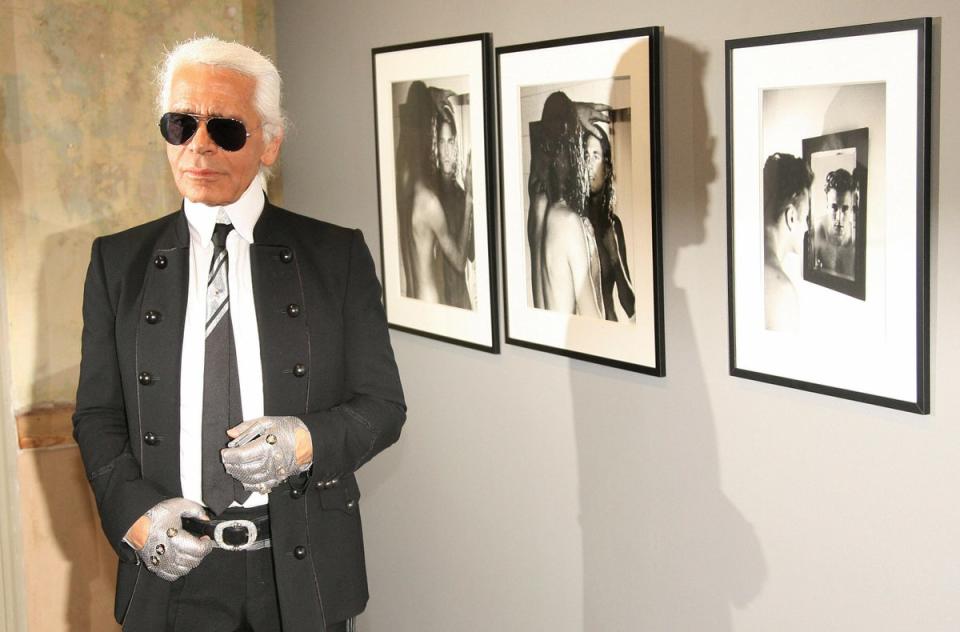 Karl stood in front of nude pictures of Brad Kroenig (DDP/AFP via Getty Images)