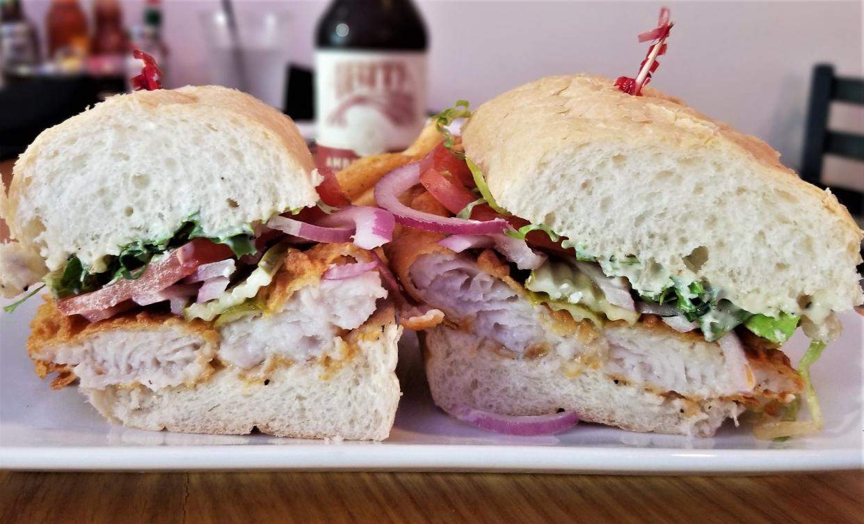 The fried catfish po’ boy at St. Armands Oyster Bar on St. Armands Circle in Sarasota photographed July 30, 2022.