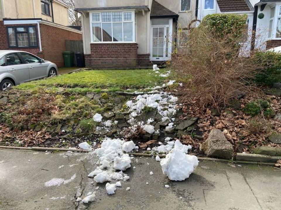 A family were left stunned after footage from their doorbell camera footage revealed a man had got out of his car and kicked down a snowman built by a nine-year-old girl. 

The furious mum and dad, from Dudley, West Midlands, assumed the snowman, built during this week's wintry conditions, had fallen over on its own.

Caption: The remains of a snowman that was kicked apart by a passing driver in Dudley, West Midlands